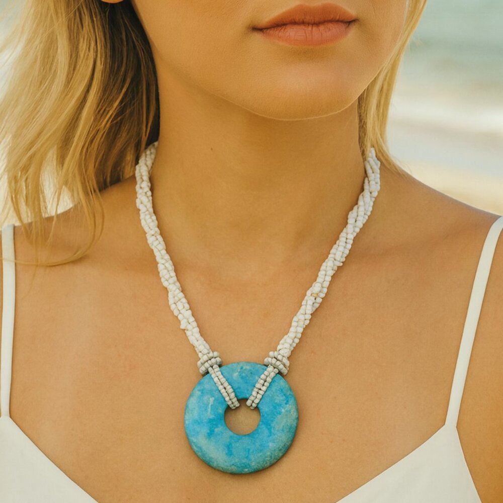 WHITE SEED BEADS NECKLACE WITH A LARGE ROUND TURQUOISE PENDANT (19 in length)...